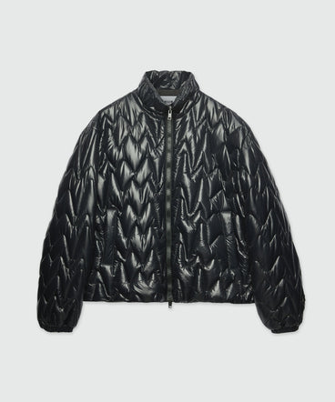 Black quilted jacket with "TheMwave" motif