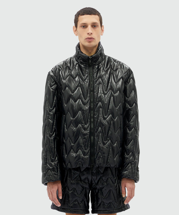 Black quilted jacket with "TheMwave" motif