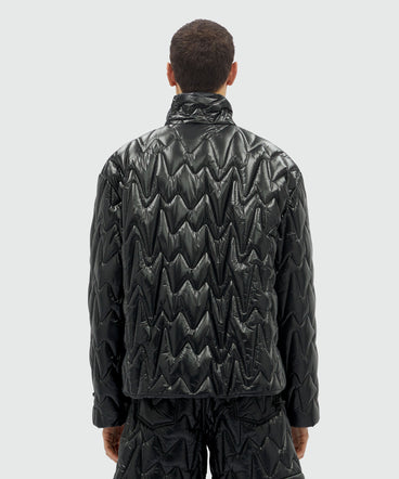 Black quilted jacket with "TheMwave" motif