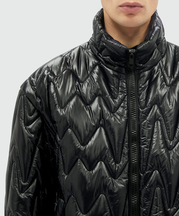 Black quilted jacket with "TheMwave" motif