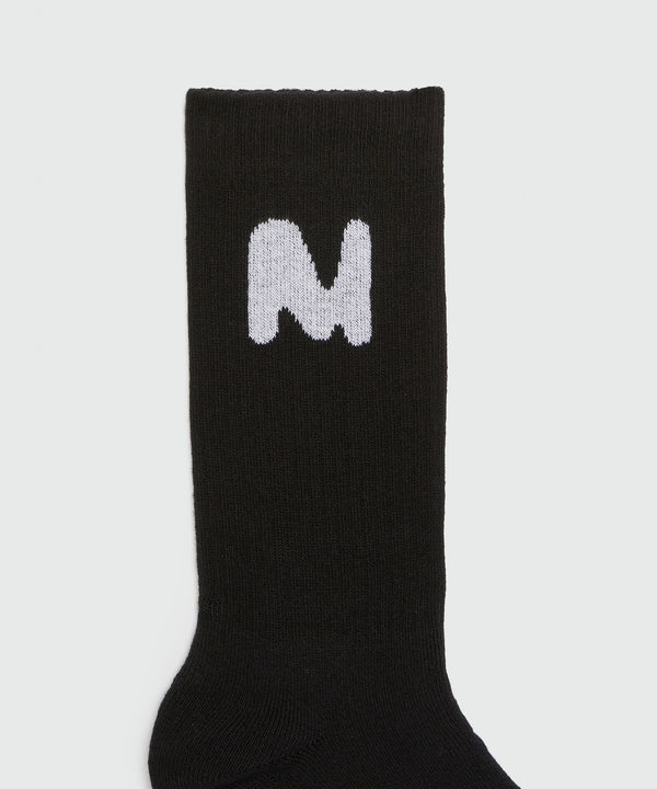 Black socks with "TheMwave" jacquard graphic