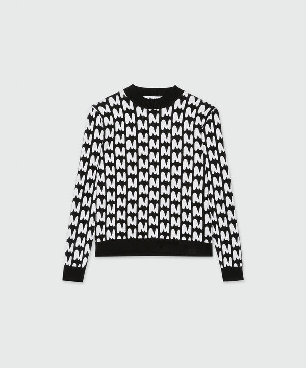 Black and white sweater with "TheMwave" pattern