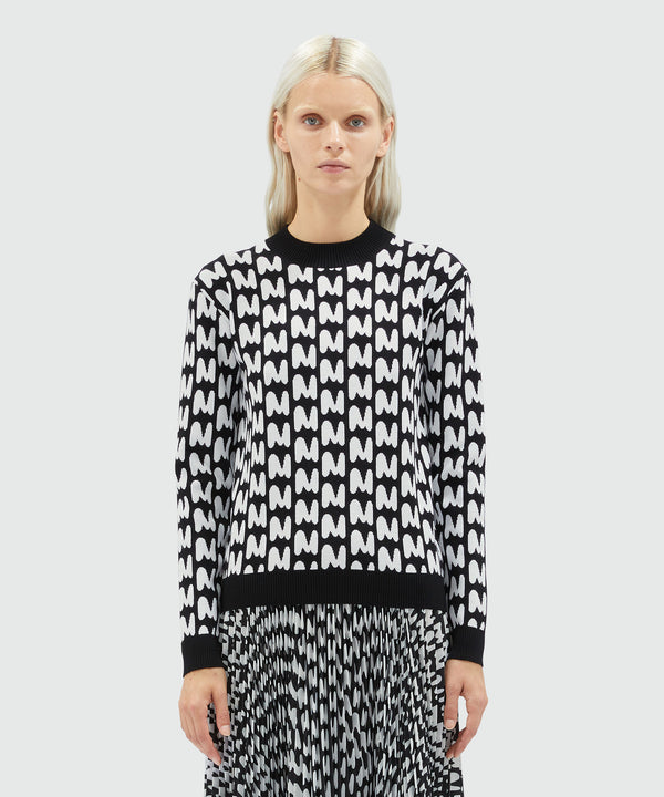 Black and white sweater with "TheMwave" pattern