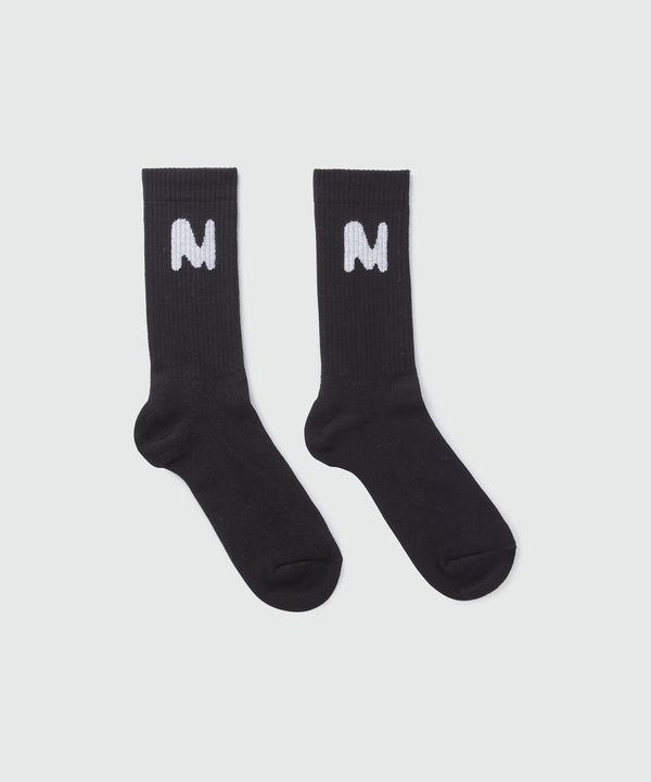 Black socks with "TheMwave" jacquard graphic
