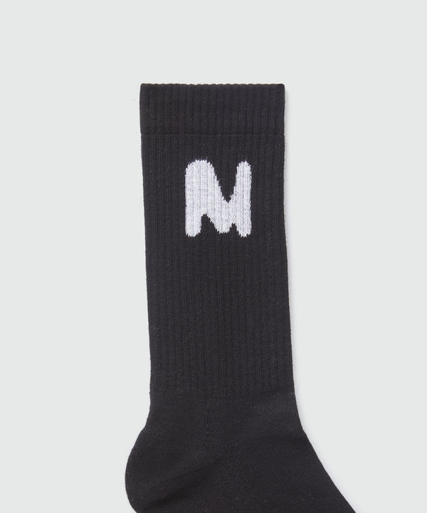 Black socks with "TheMwave" jacquard graphic