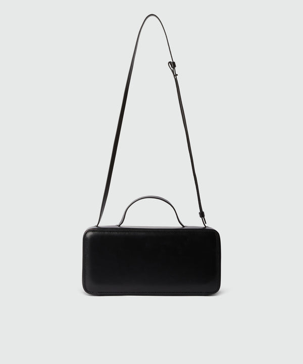 Large shiny leather baguette bag