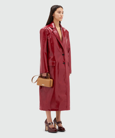 Red patent leather coat with structured shoulders