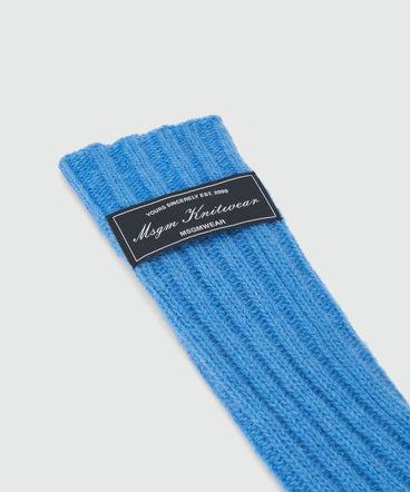 Long blue ribbed woolen gloves