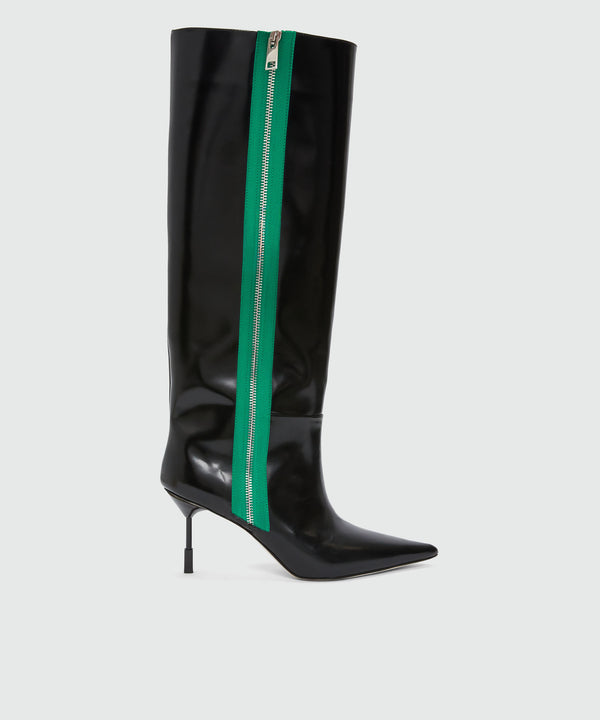 Black patent leather boots with green zipper