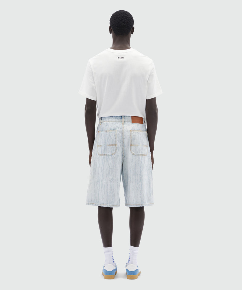 Bermuda shorts in light denim with a destroyed effect 84 Men 