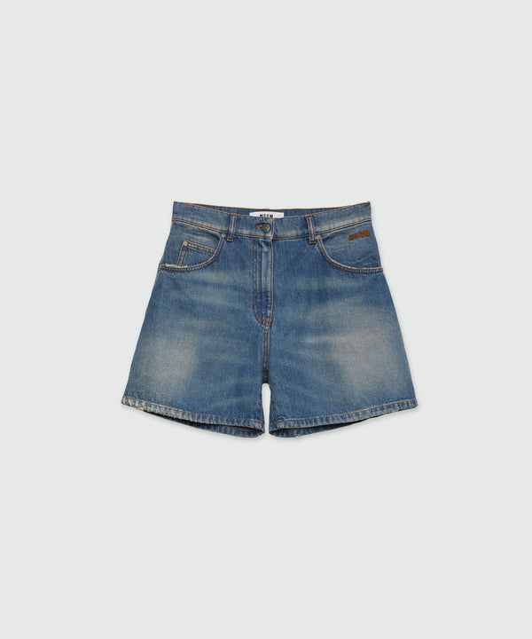 Shorts in washed indigo denim and MSGM logo