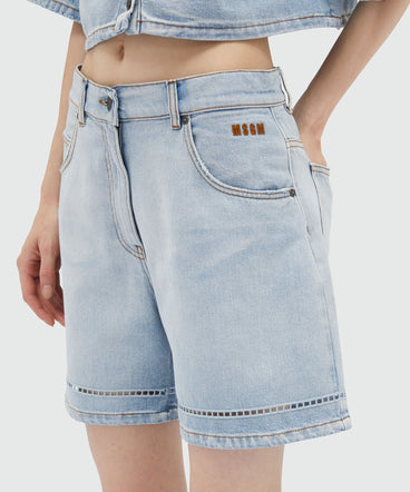 Shorts in perforated light washed denim