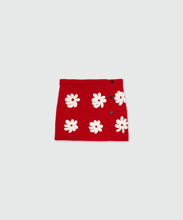 Short knit skirt with crochet flowers