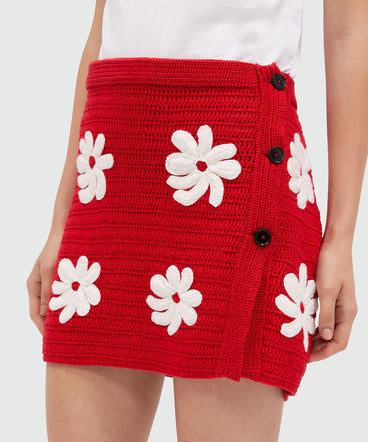 Short knit skirt with crochet flowers