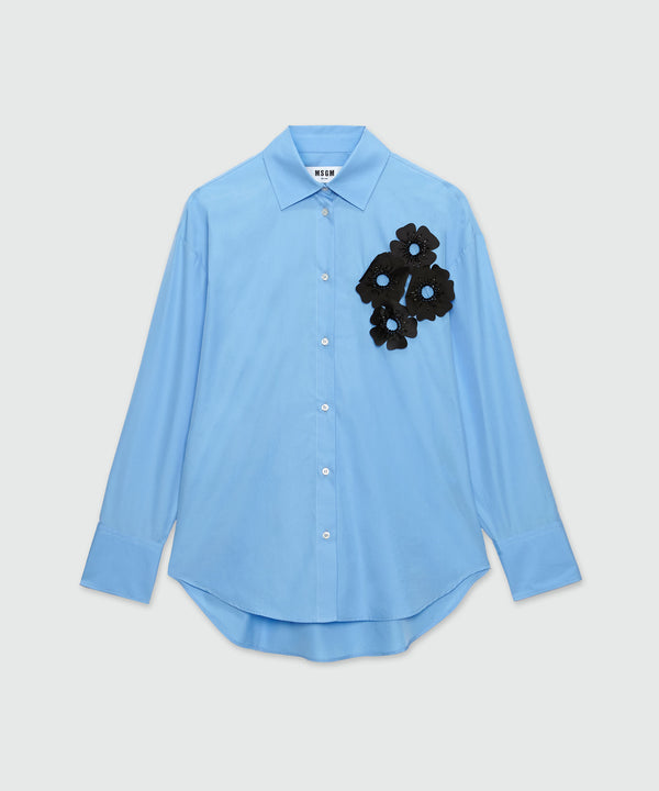 Light blue poplin shirt with floral applications