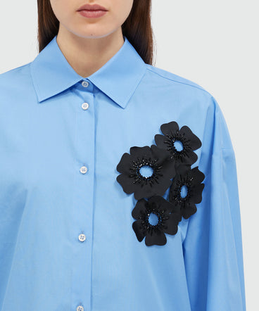 Light blue poplin shirt with floral applications