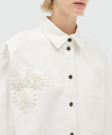 White denim shirt with raffia flowers