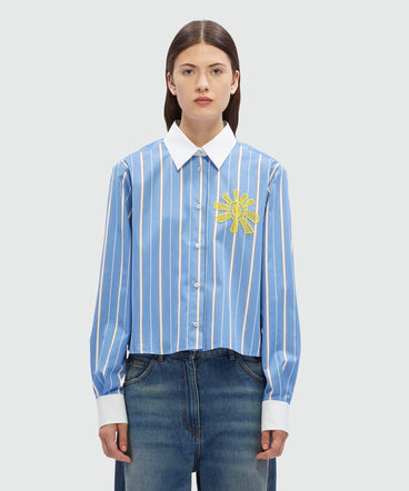 Striped light blue poplin shirt with sun detail