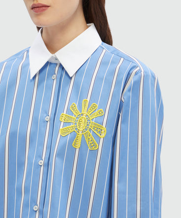 Striped light blue poplin shirt with sun detail