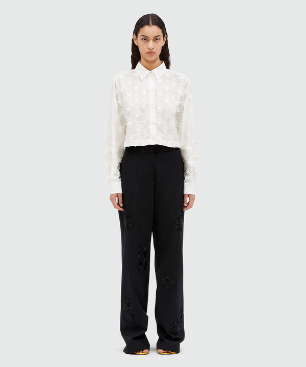 Wool trousers with raffia applications