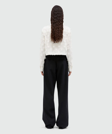 Wool trousers with raffia applications