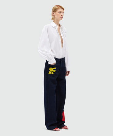 Indigo raw denim trousers with embroidery