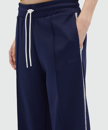 Blue jogger trousers with embroidery à jour