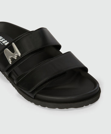 Flat sandals in black leather and "TheMwave" logo