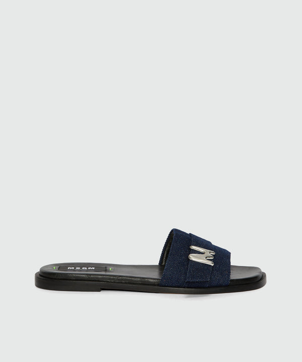 Flat sandals in indigo denim with "TheMwave" detail