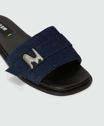 Flat sandals in indigo denim with "TheMwave" detail