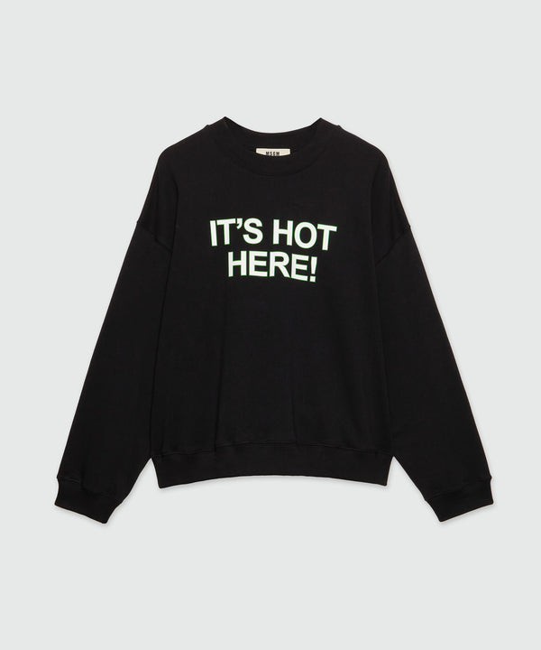 Black organic cotton sweatshirt with quotes "IT'S HOT HERE!"