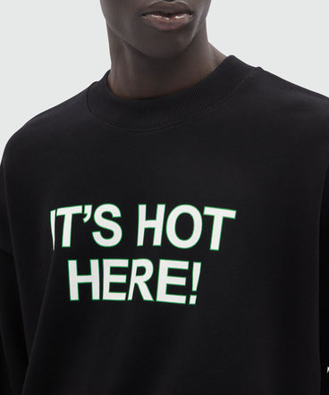 Black organic cotton sweatshirt with quotes "IT'S HOT HERE!"